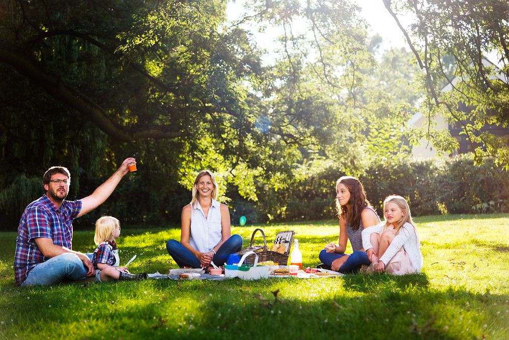 Happy family picnic in the park