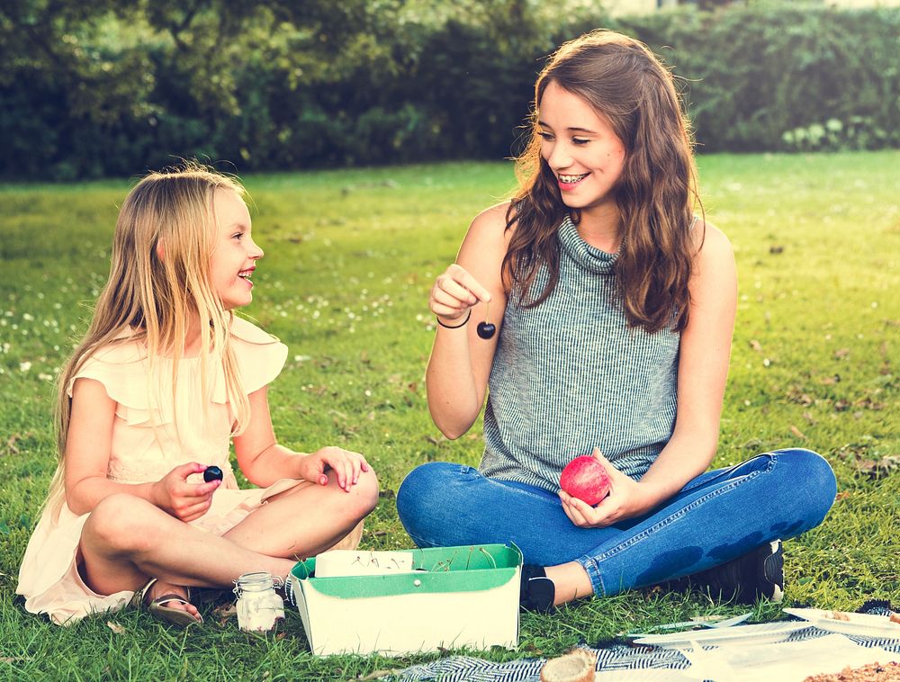 Sister Girls Talk Picnic Togetherness Outdoors Concept