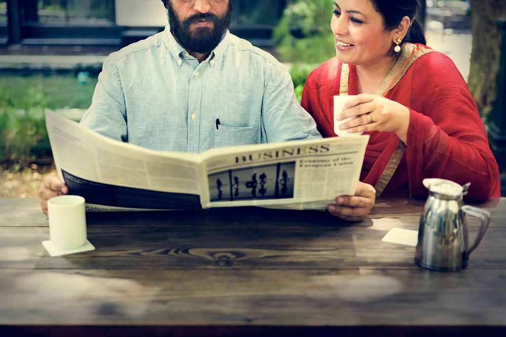 Indian Couple Reading Newspaper Concept