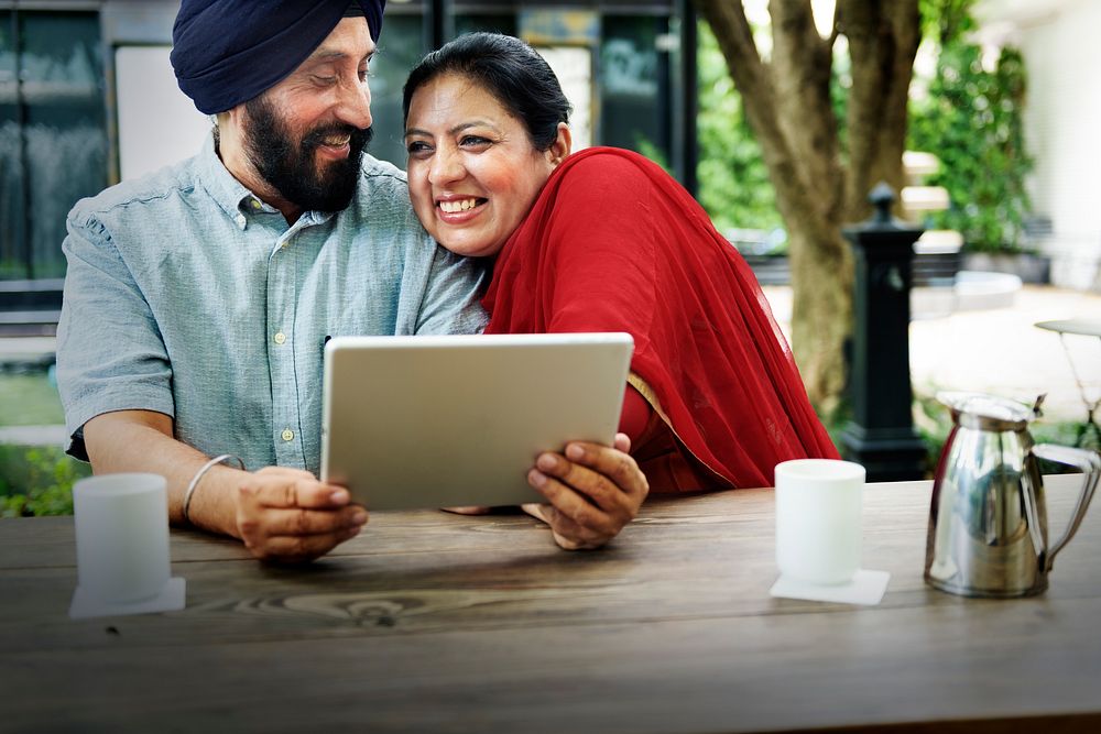 Indian Couple Using Device Concept
