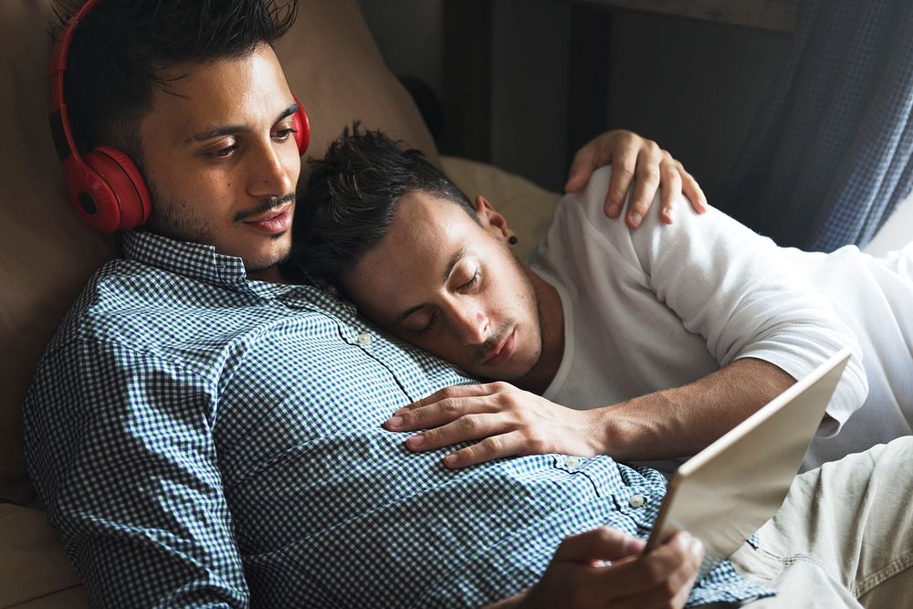 Sweet gay male couple close together