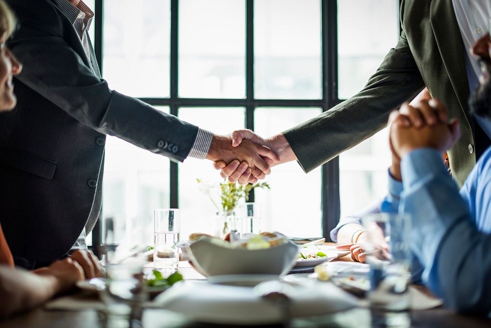Business People Shaking Hands Agreement Concept