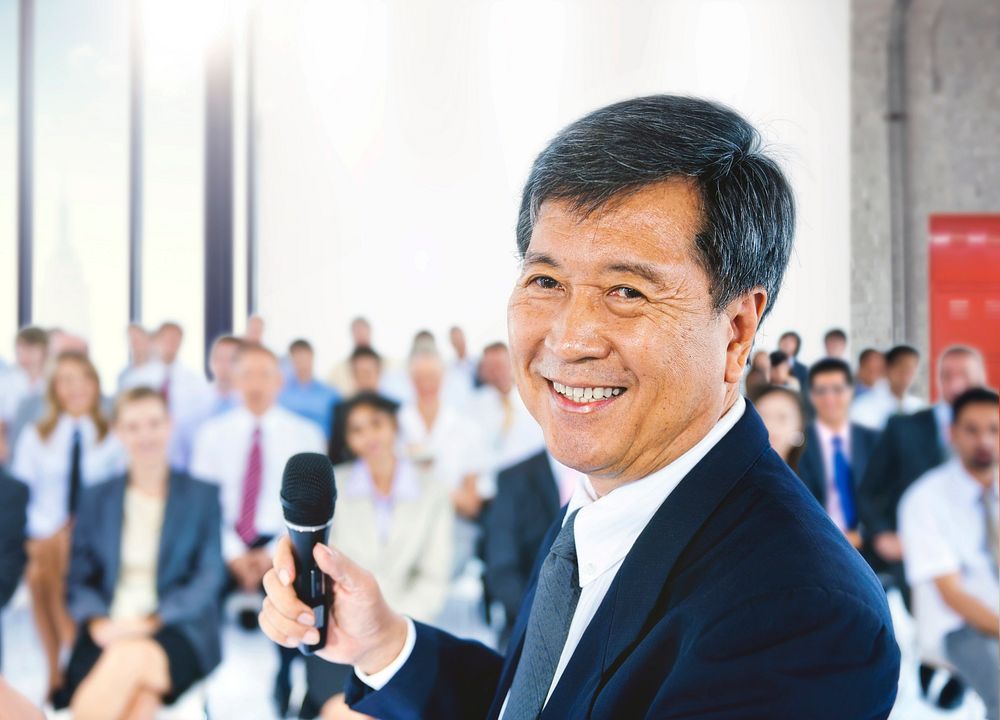 Mature businessman presenting at a conference