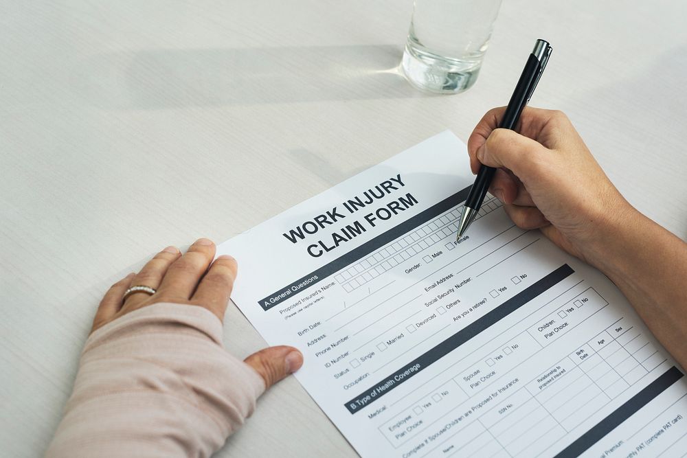 Bandaged woman filling out a form