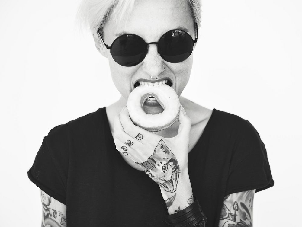 A blonde short-haired woman with tattoos