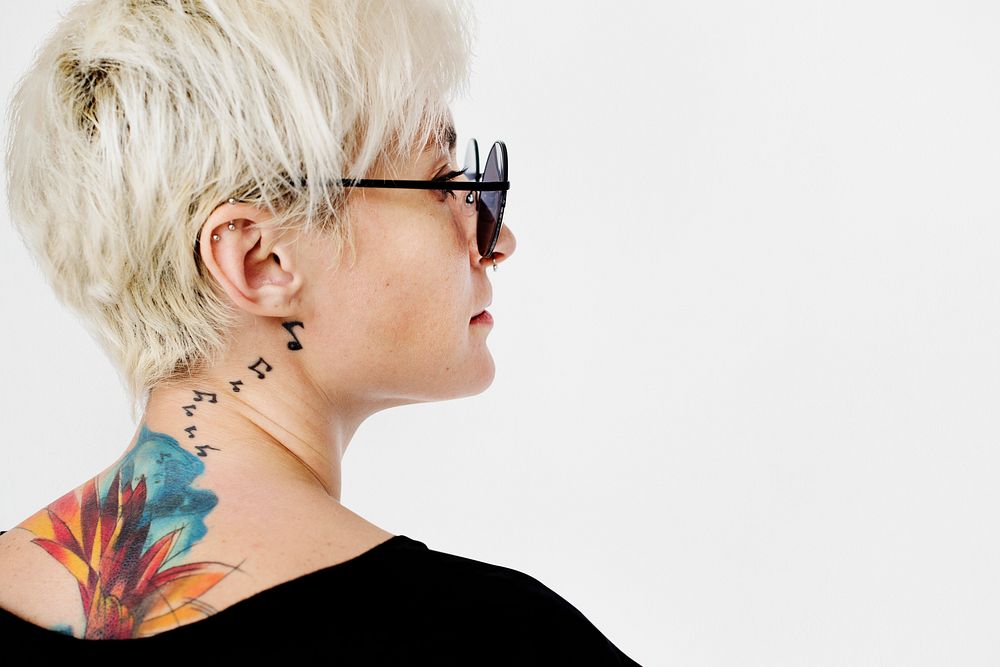 Stylish woman with a tattoo on her neck