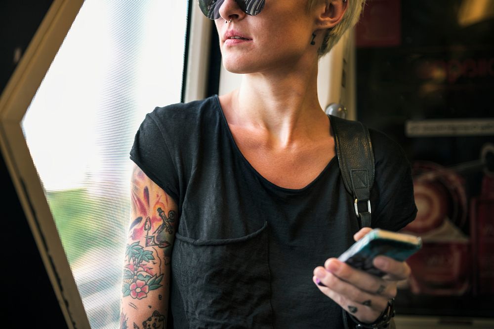 Tattooed woman on a train