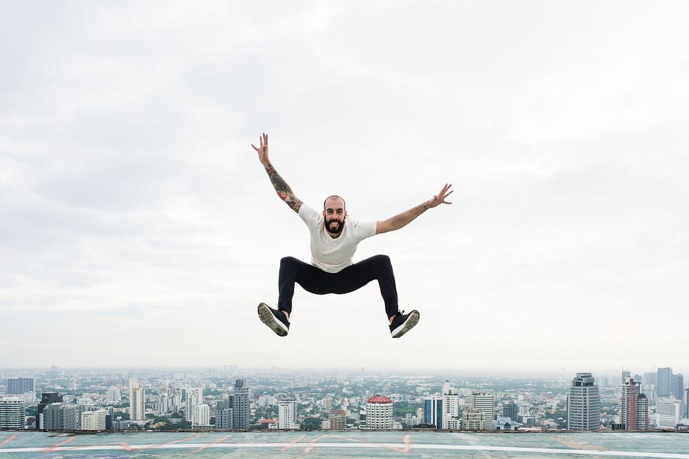 Man jumping on the rooftop