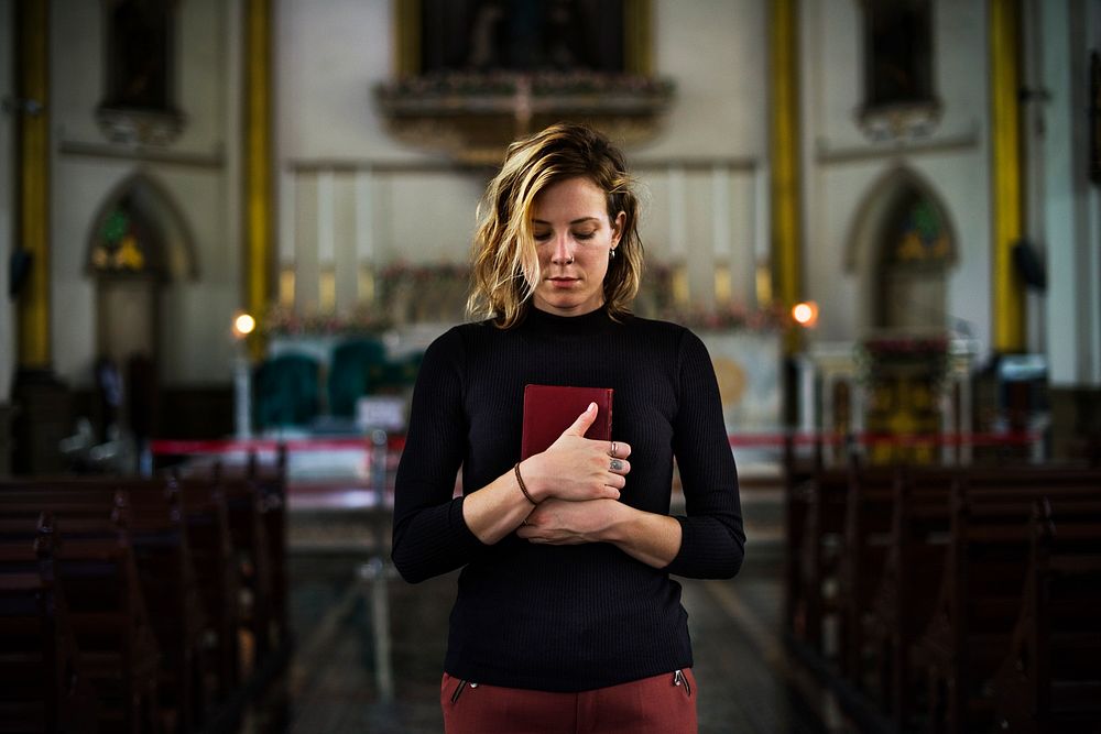 Woman praying in the church