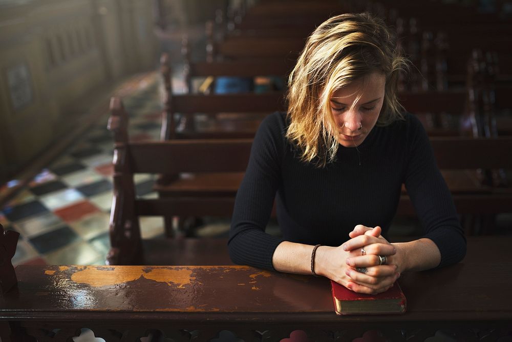 Woman praying in the church