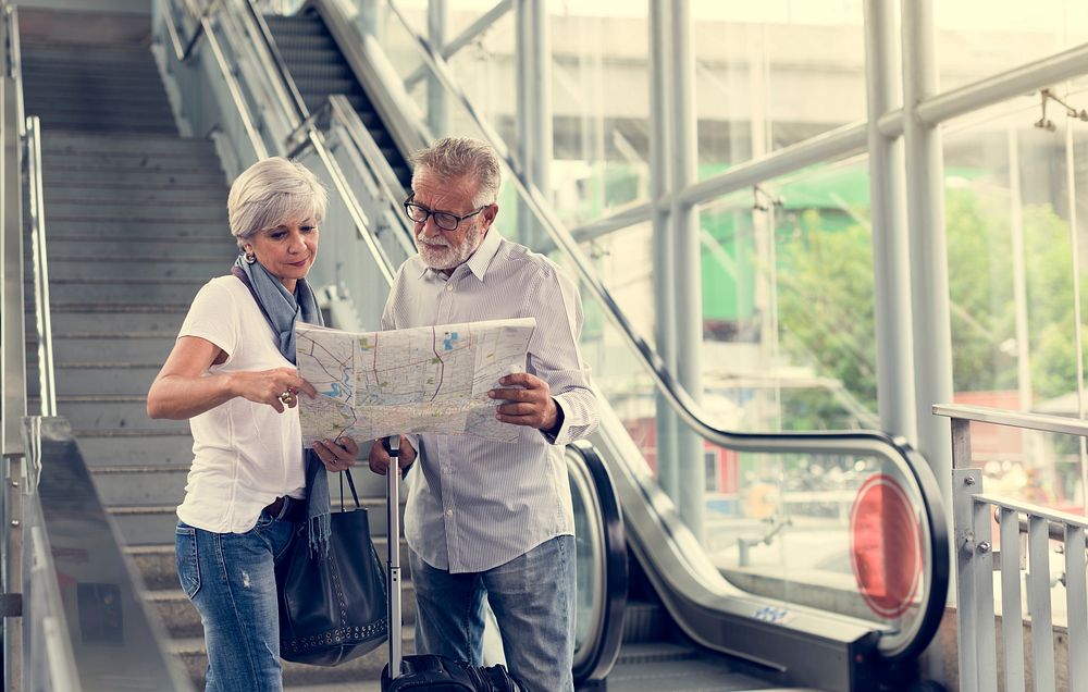 Senior couple tourists traveling city