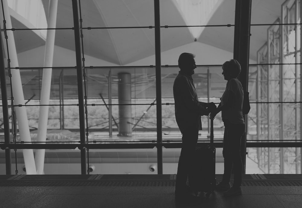 Silhouette Senior couple traveling airport scene