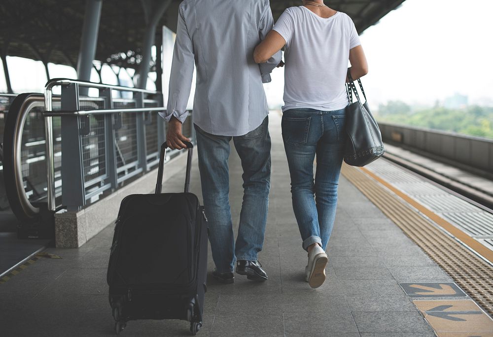 Senior couple traveling train station