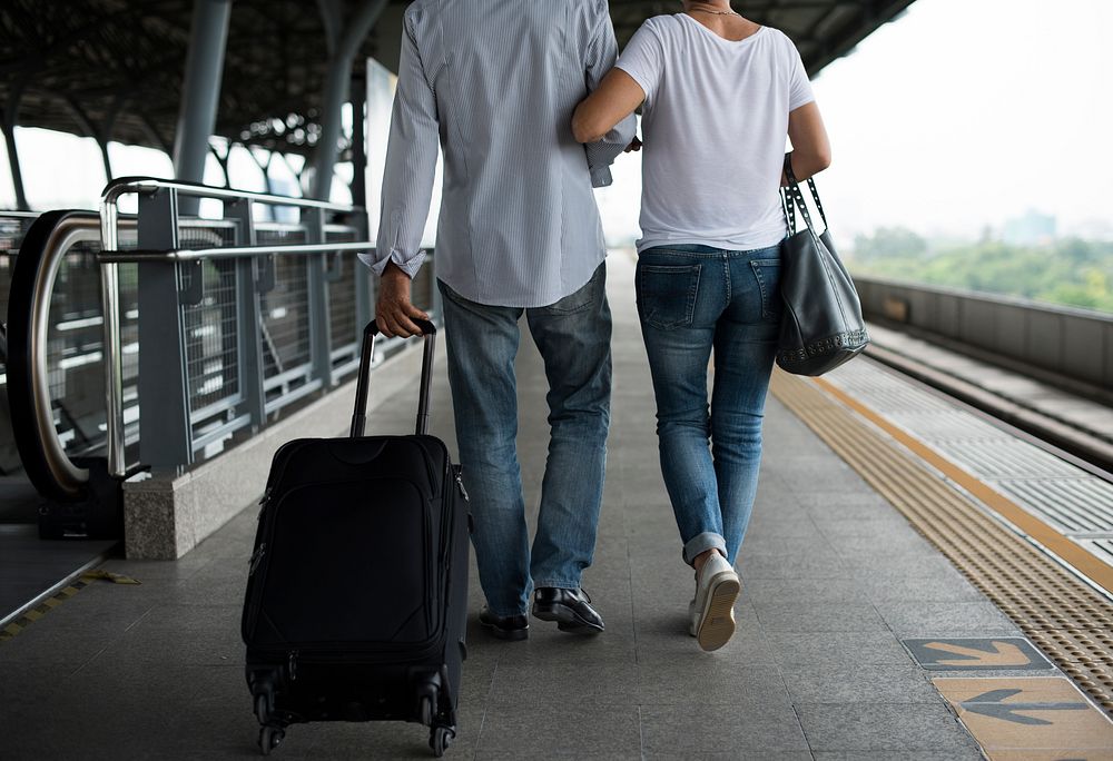 Senior couple traveling train station