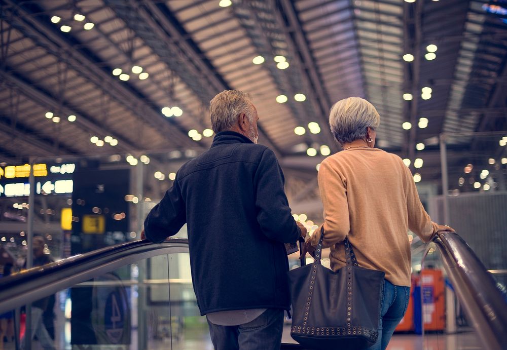 Senior couple traveling around the city