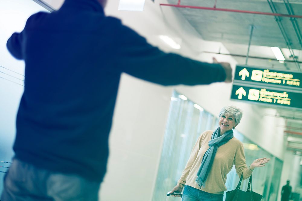 Old guy picking up his woman at the airport