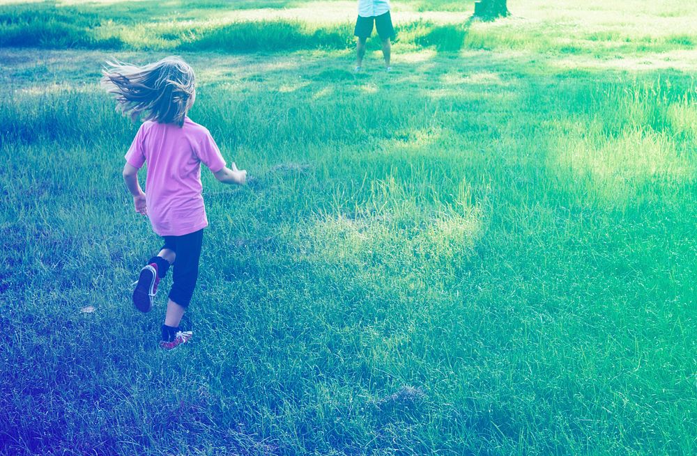 Little Girl Running in Grass Field Park Outdoors