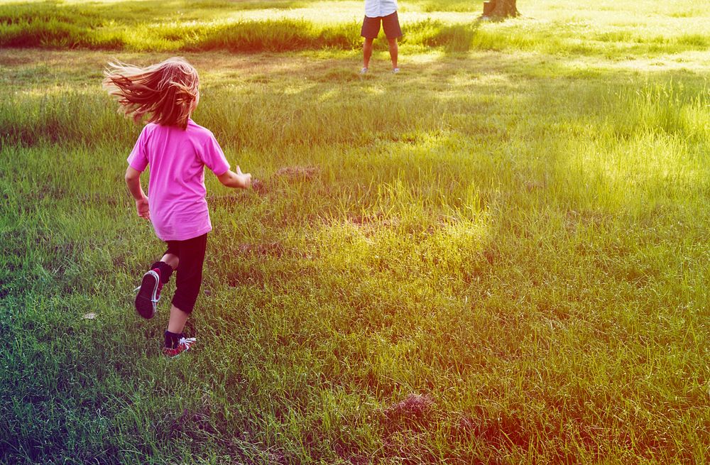 Little Girl Running in Grass Field Park Outdoors
