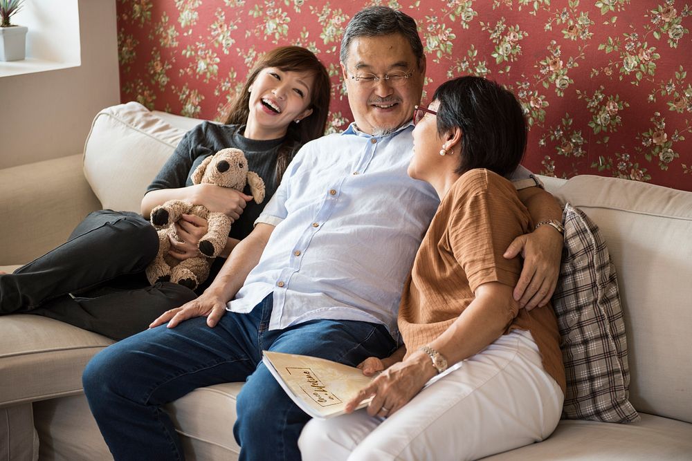 Asian family having fun in the living room together