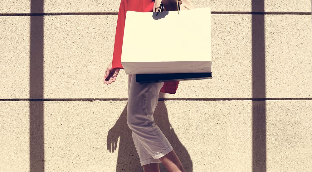 Woman walking around with shopping bag