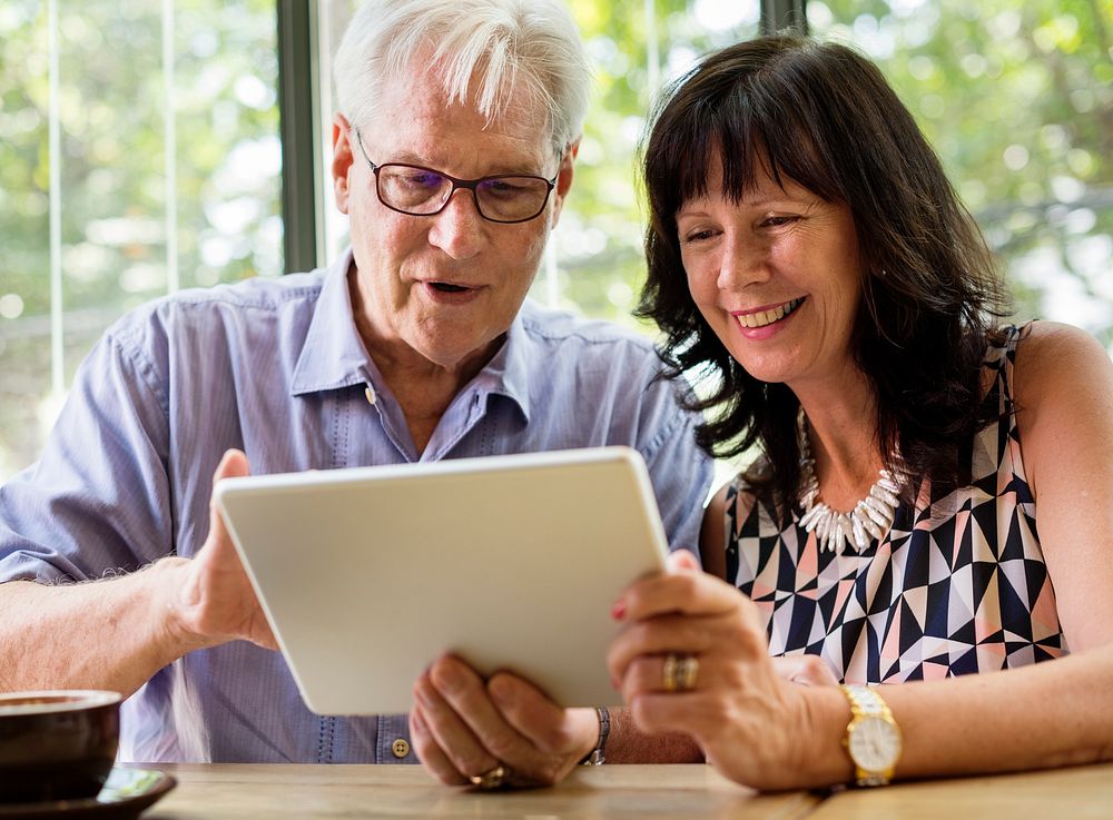 Couple using tablet browsing together