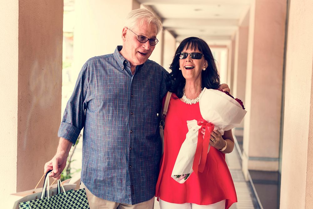 Mature couple woman bouquet of flowers