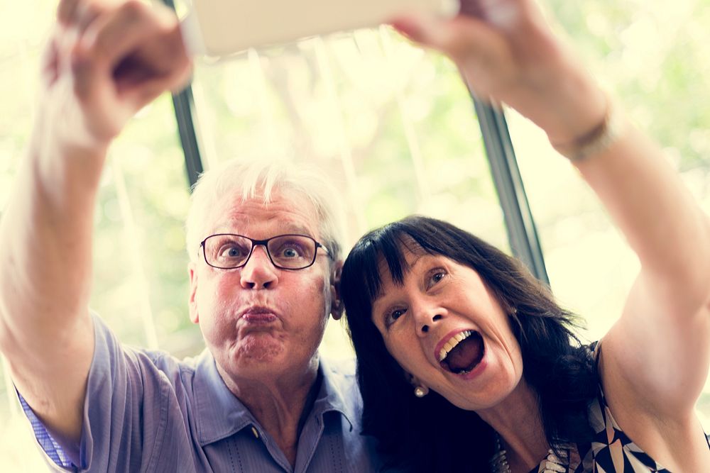 Mature couple taking selfie together