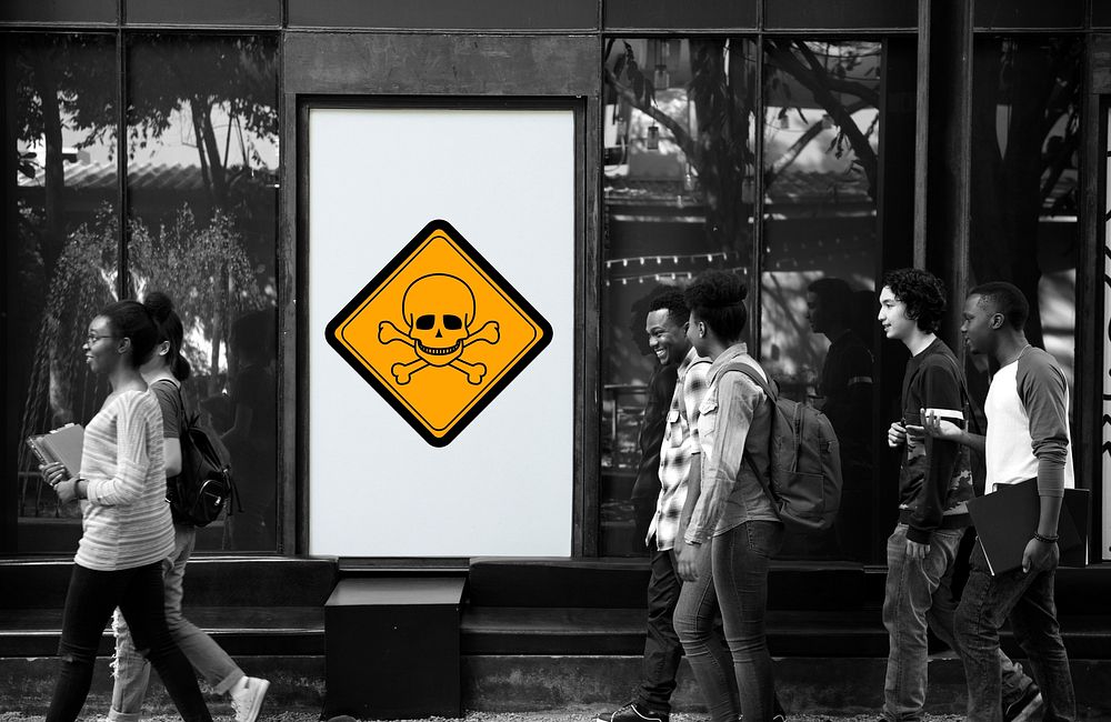 Group of People Walking with Poison Danger Sign Banner Behind