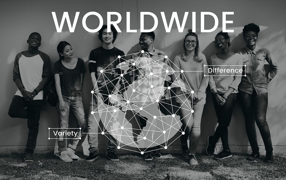 Students standing beside the wall network graphic