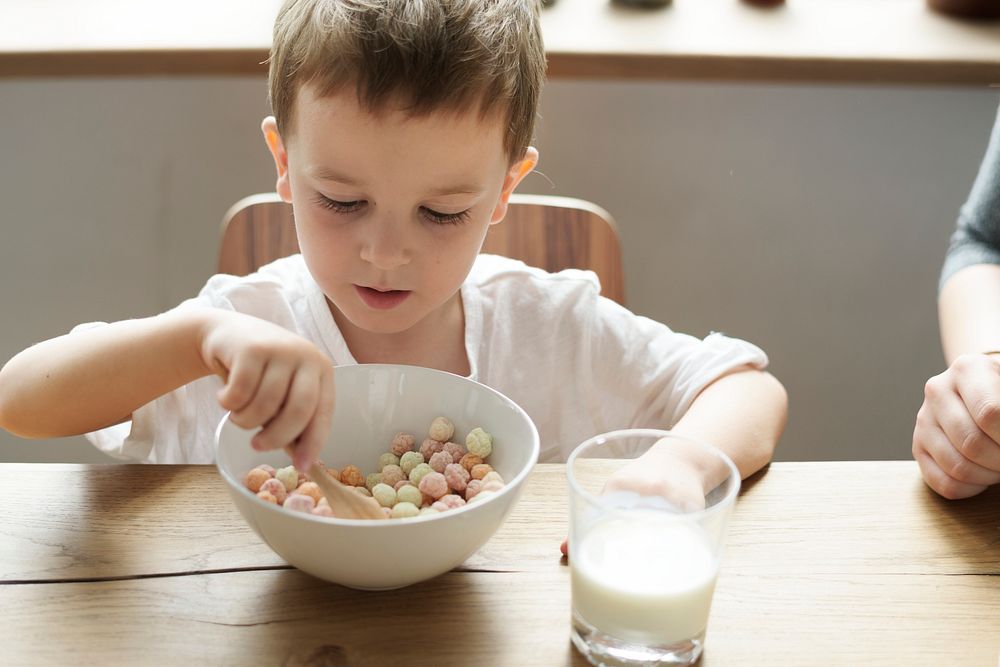 Little boy enjoying a bowl of cereal
