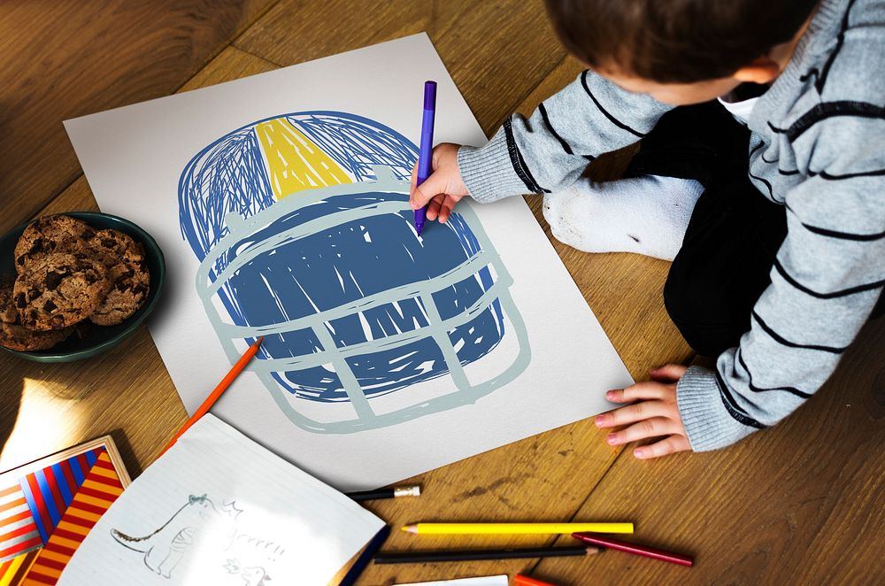 Children with a drawing of American football helmet
