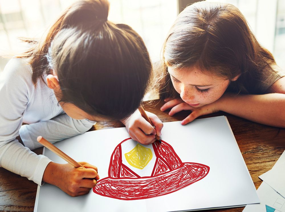 Child with a drawing of firefighter helmet