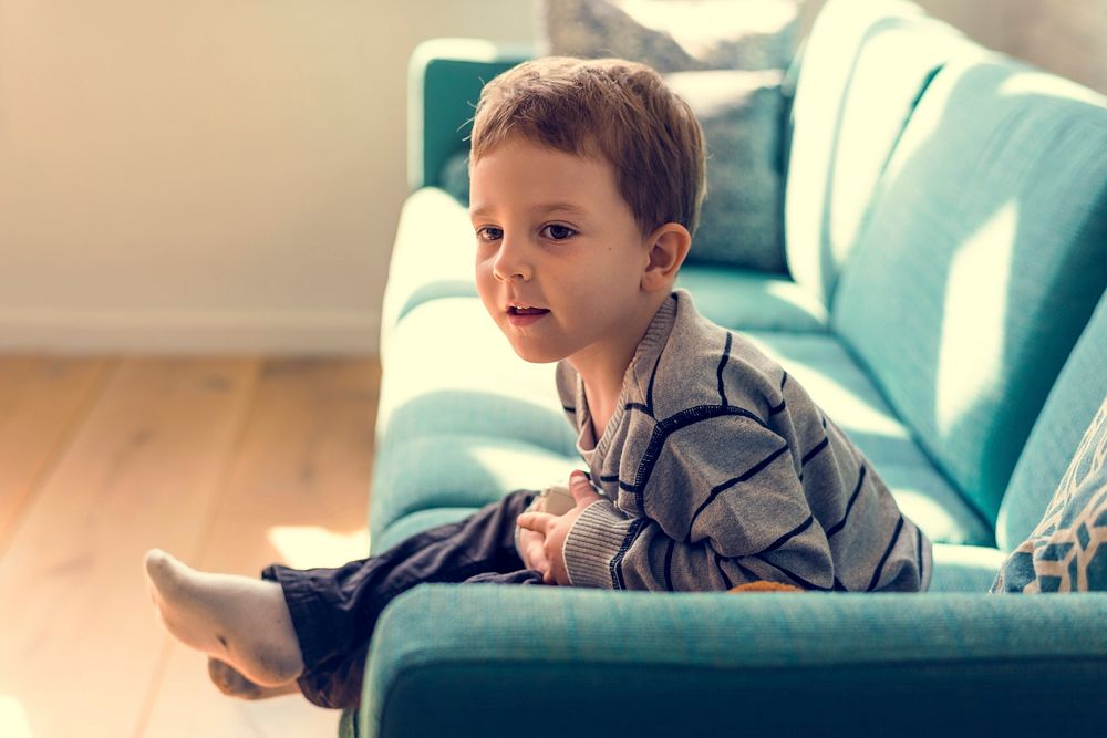 Little Boy Sitting Living Room