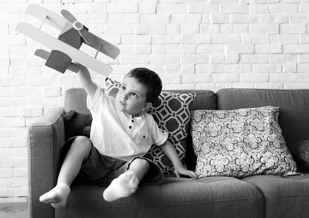 Boy Playing Plane Toy Aspiration