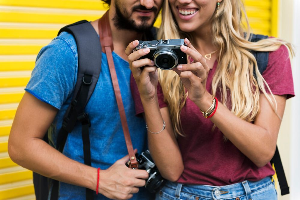 Couple traveling together with a camera
