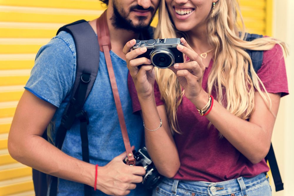 Couple traveling together with a camera
