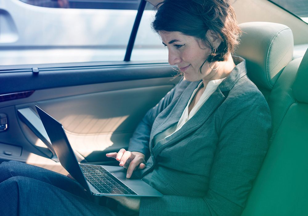 Photo Gradient Style with Businesswoman Working Using Laptop Car Inside