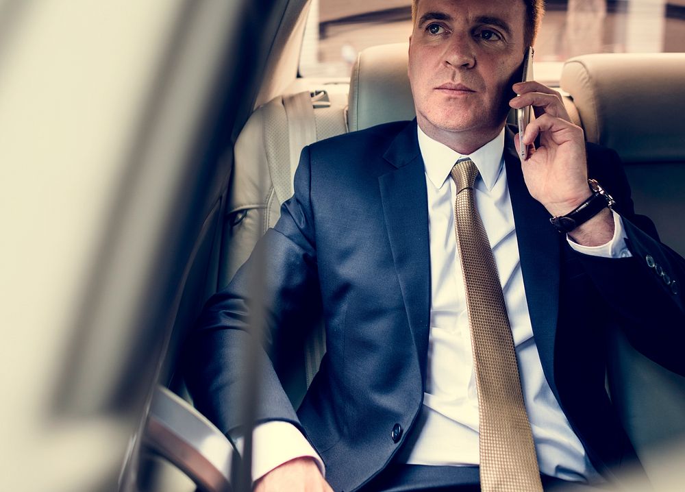 Businessman Talking Using Phone Car Inside