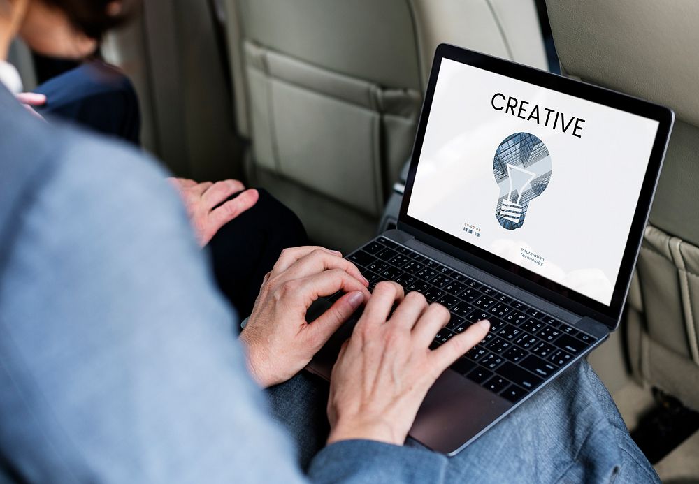 Graphic of creative ideas digital technology light bulb on laptop