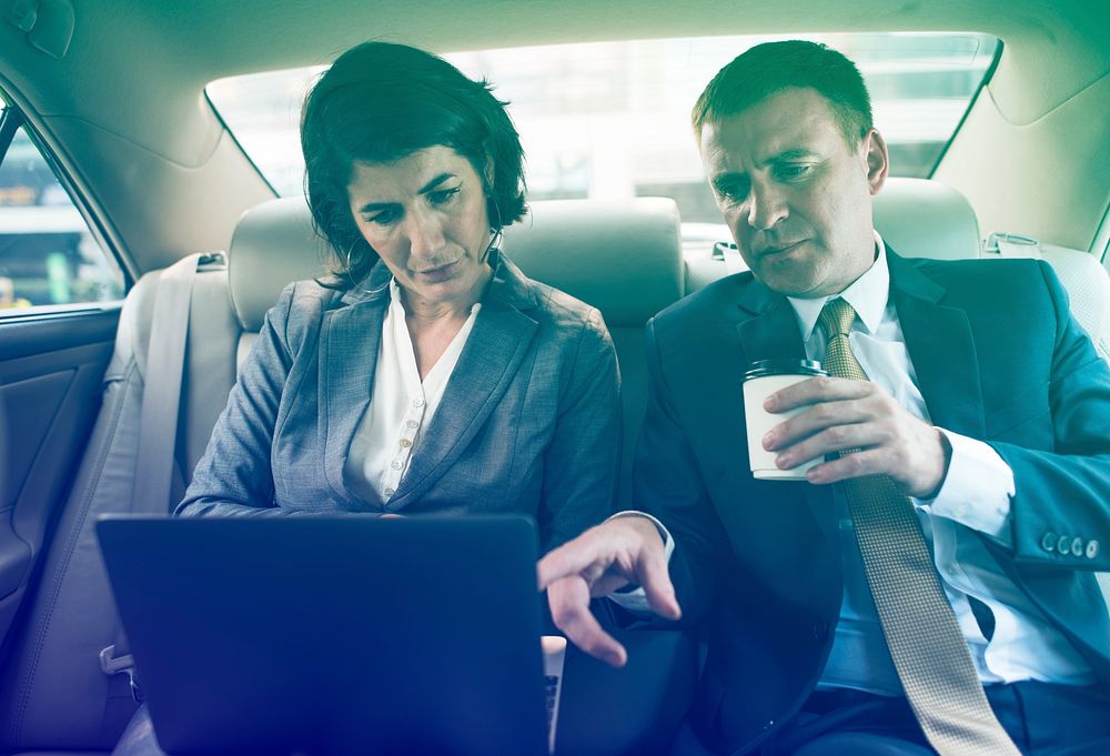 Business people meeting and discussion on backseat of the car