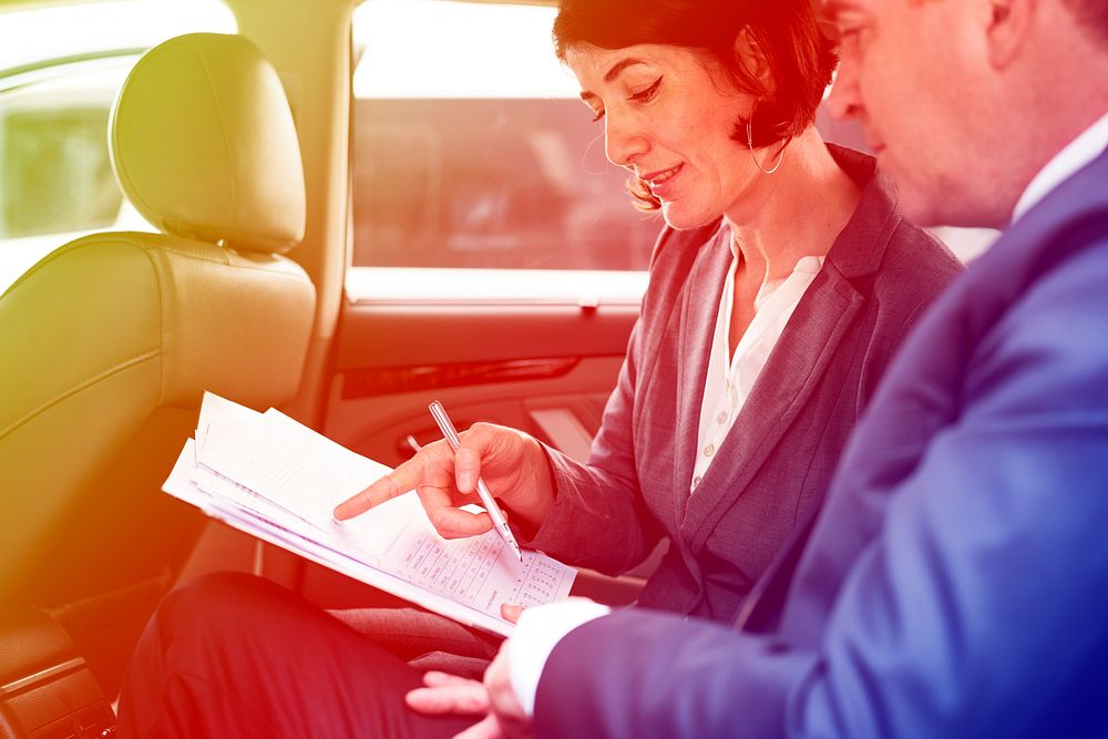 Business people meeting and discussion on backseat of the car