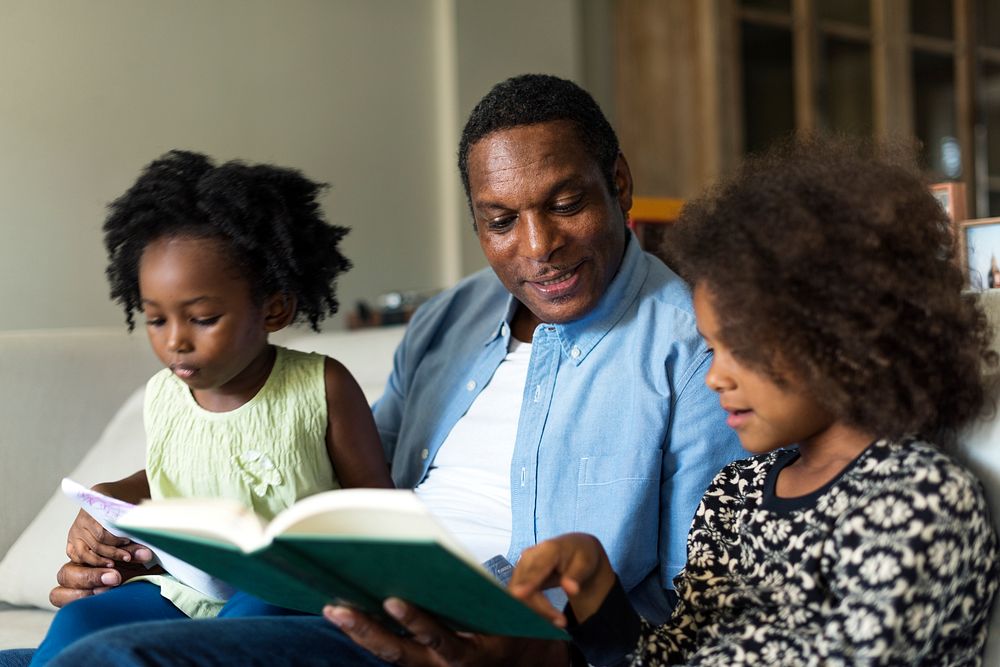 African family reading a book