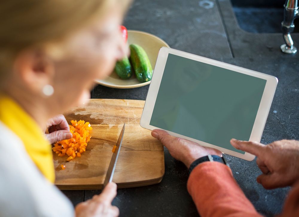 Looking at blank tablet screen while cooking