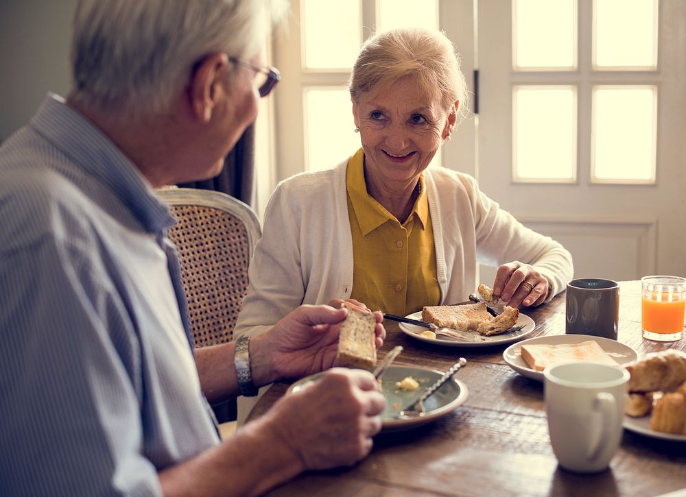 Senior Adult Couple Eat Breakfast
