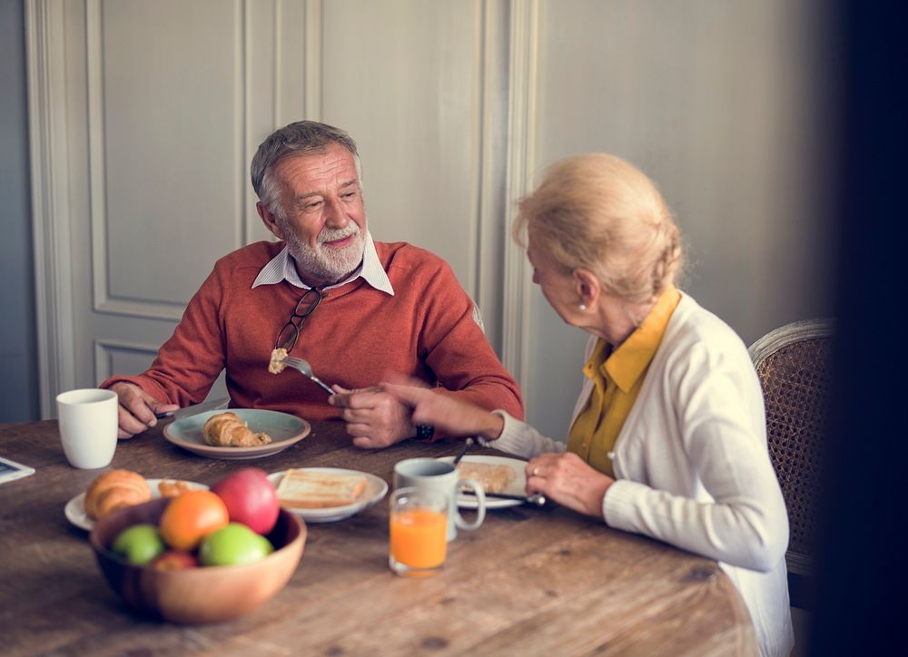 Senior Adult Couple Eat Breakfast
