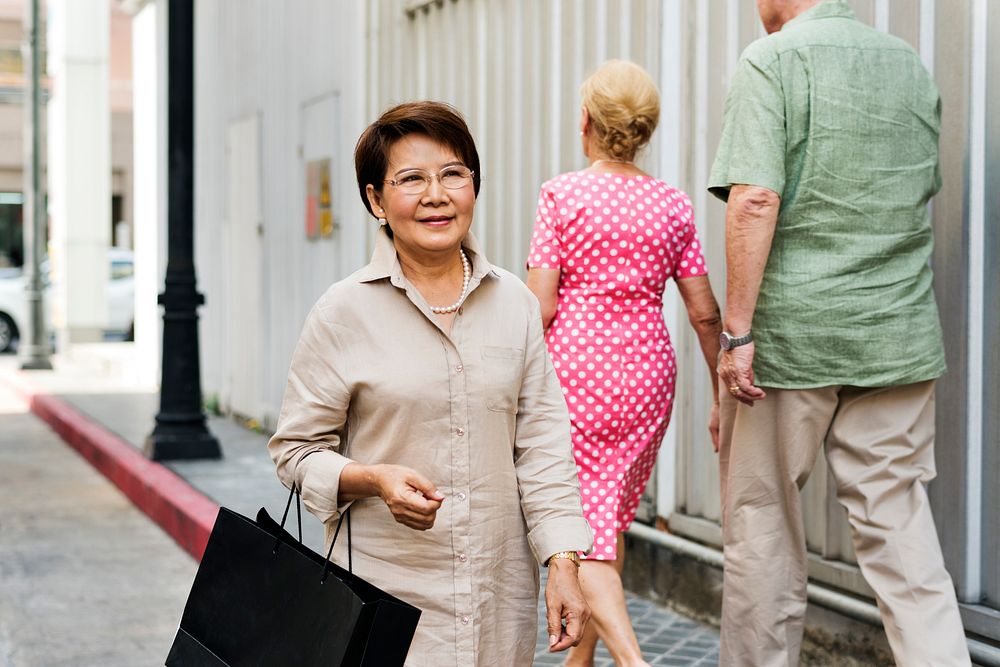 Elderly woman walking on the street