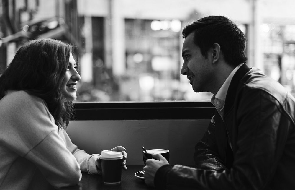 Couple drinking coffee at a cafe