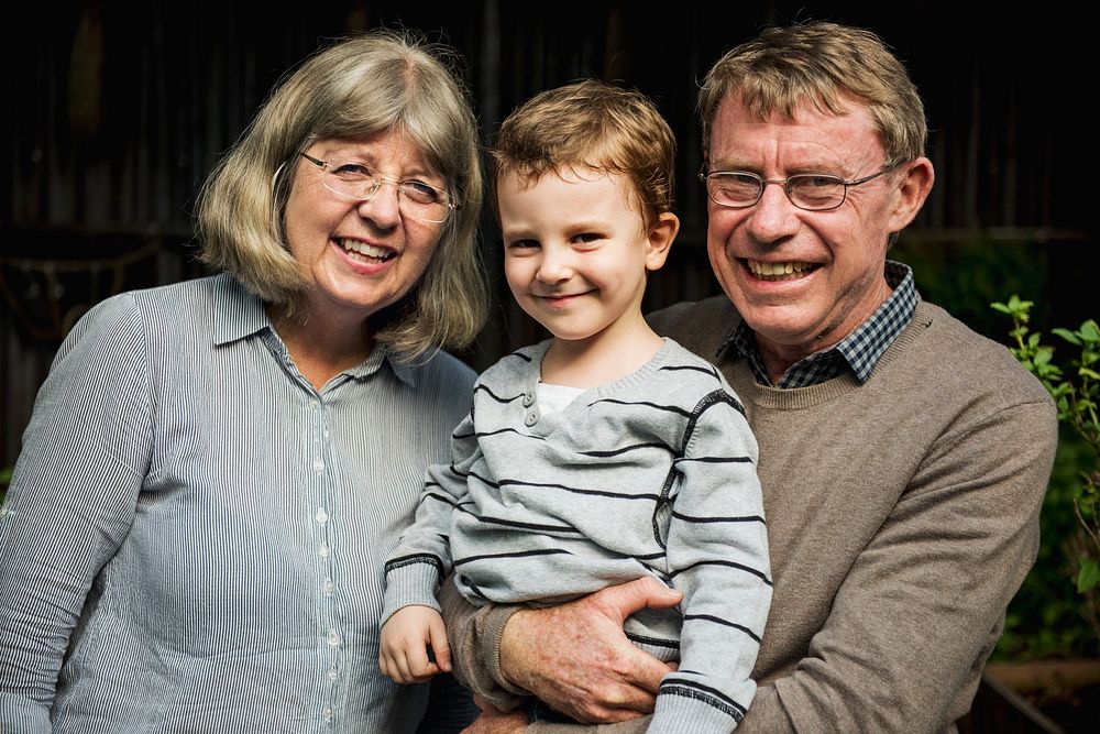 Caucasian kid with grandparents cheerful family portrait