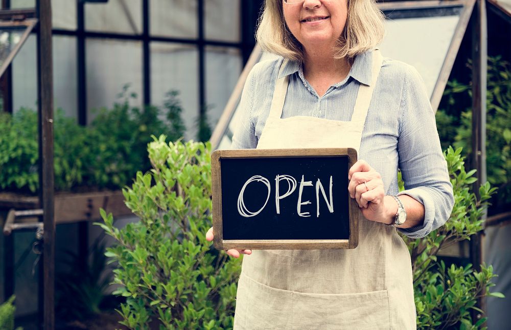 Mature Lady Open Sign Garden Shop