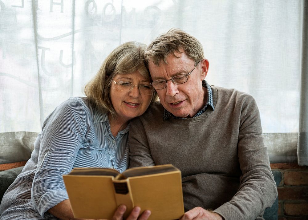 Mature Couple Reading Books Together